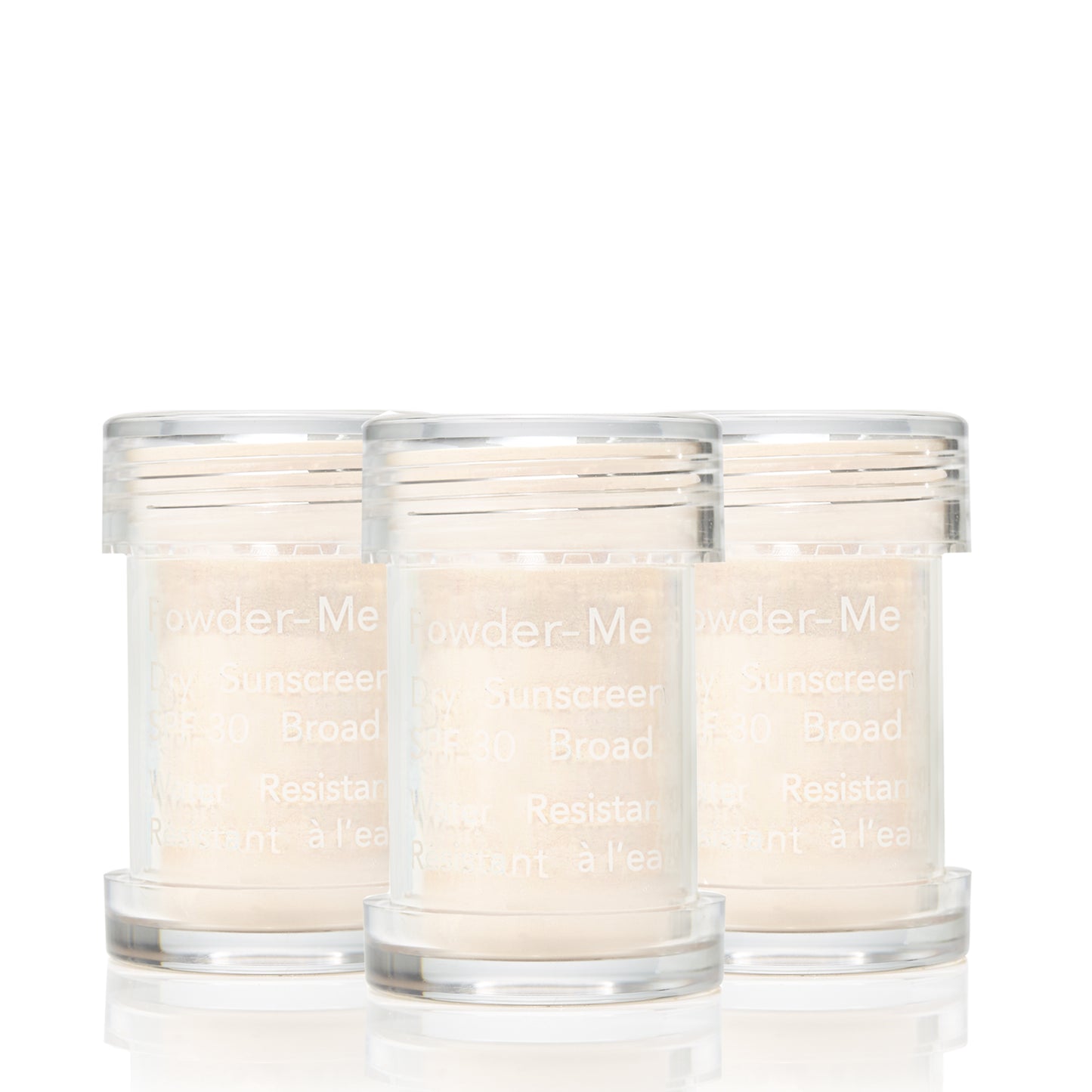 Powder-Me SPF 30 Dry Sunscreen in three clear canisters, showcasing finely milled, water-resistant powder for broad-spectrum UV protection.