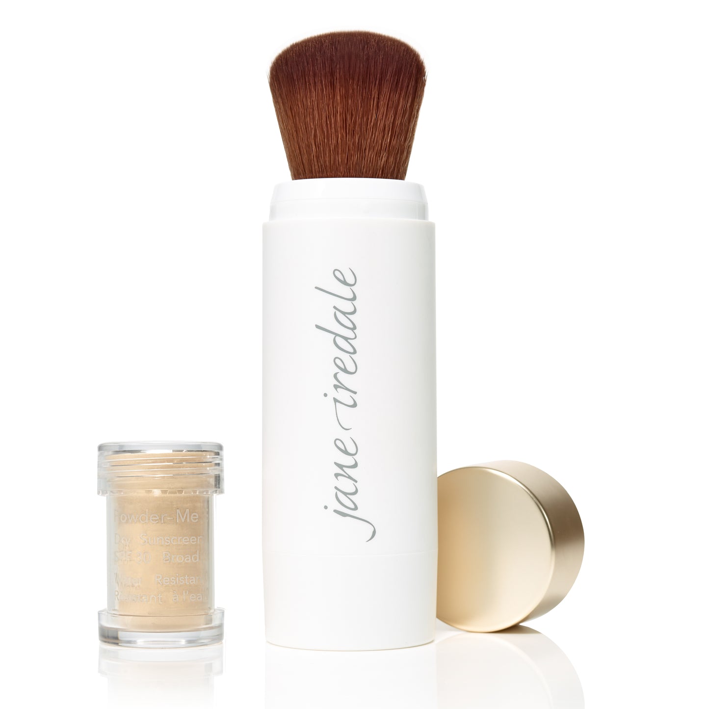 Powder-Me SPF 30 Dry Sunscreen kit with jane iredale applicator brush and loose beige powder jar, ideal for clean, sustainable beauty routines.