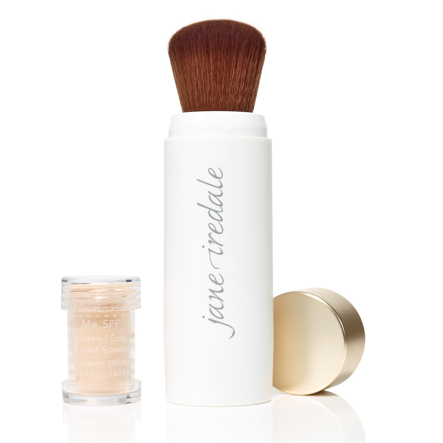 Jane Iredale's Powder-Me SPF 30 Dry Sunscreen with retractable brush and refill pot, ideal for clean, sustainable beauty enthusiasts at Beauty Shop Bellaire.