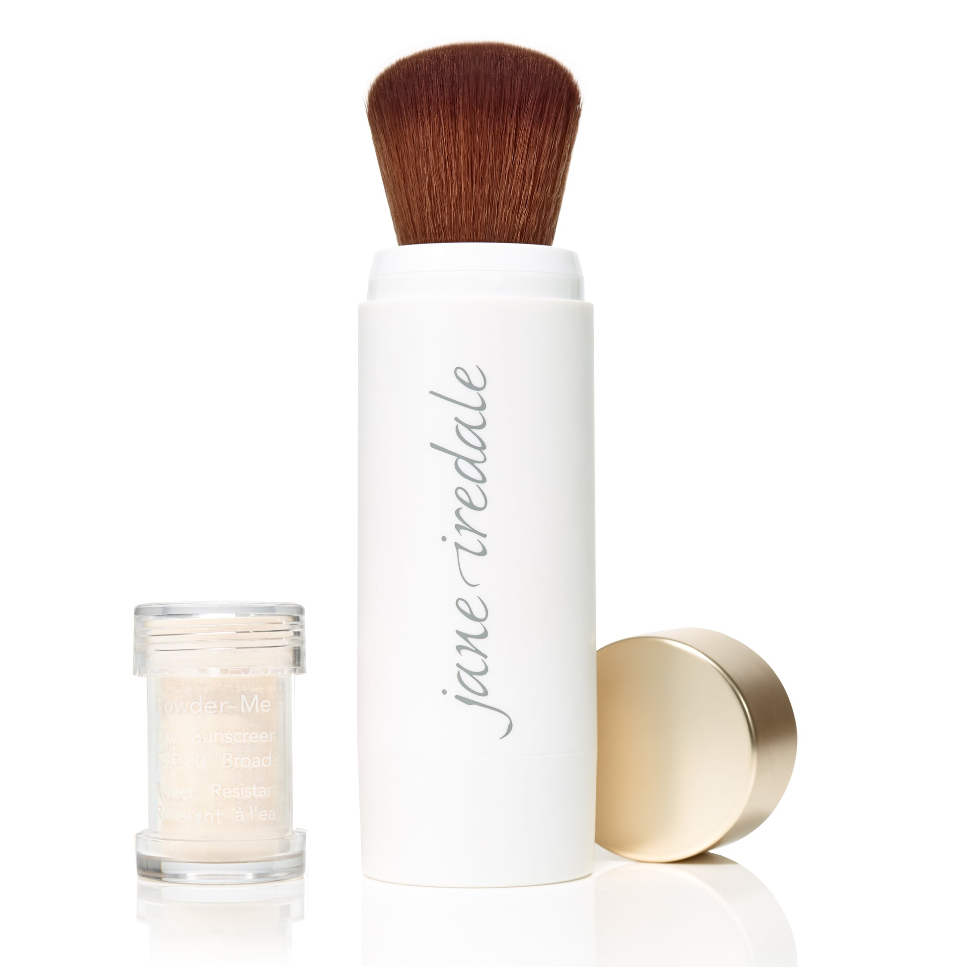 Powder-Me SPF 30 Dry Sunscreen with retractable kabuki brush, featuring loose mineral powder in a sample pot from Beauty Shop Bellaire's sustainable beauty collection.