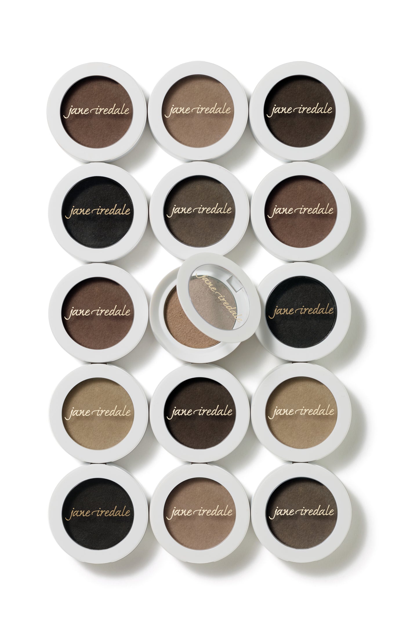 PureBrow® Brow Powder compacts in neutral shades, showcasing finely milled powder for natural, buildable brow definition, stamped with jane iredale in gold script.