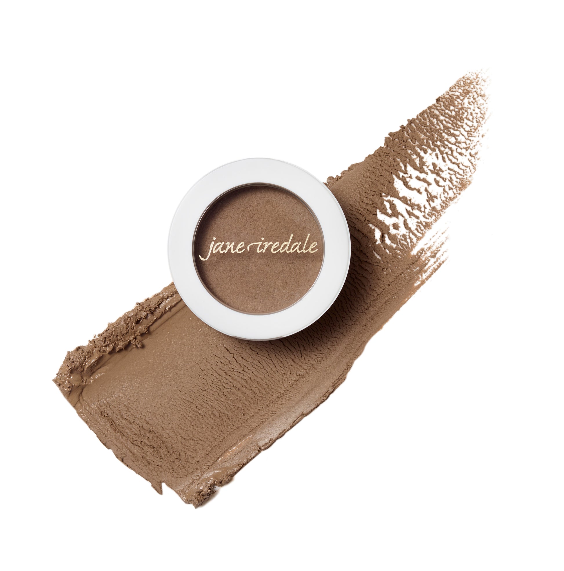 PureBrow® Brow Powder compact on a textured smear, highlighting its buildable, blendable formula for natural, long-lasting brow definition.