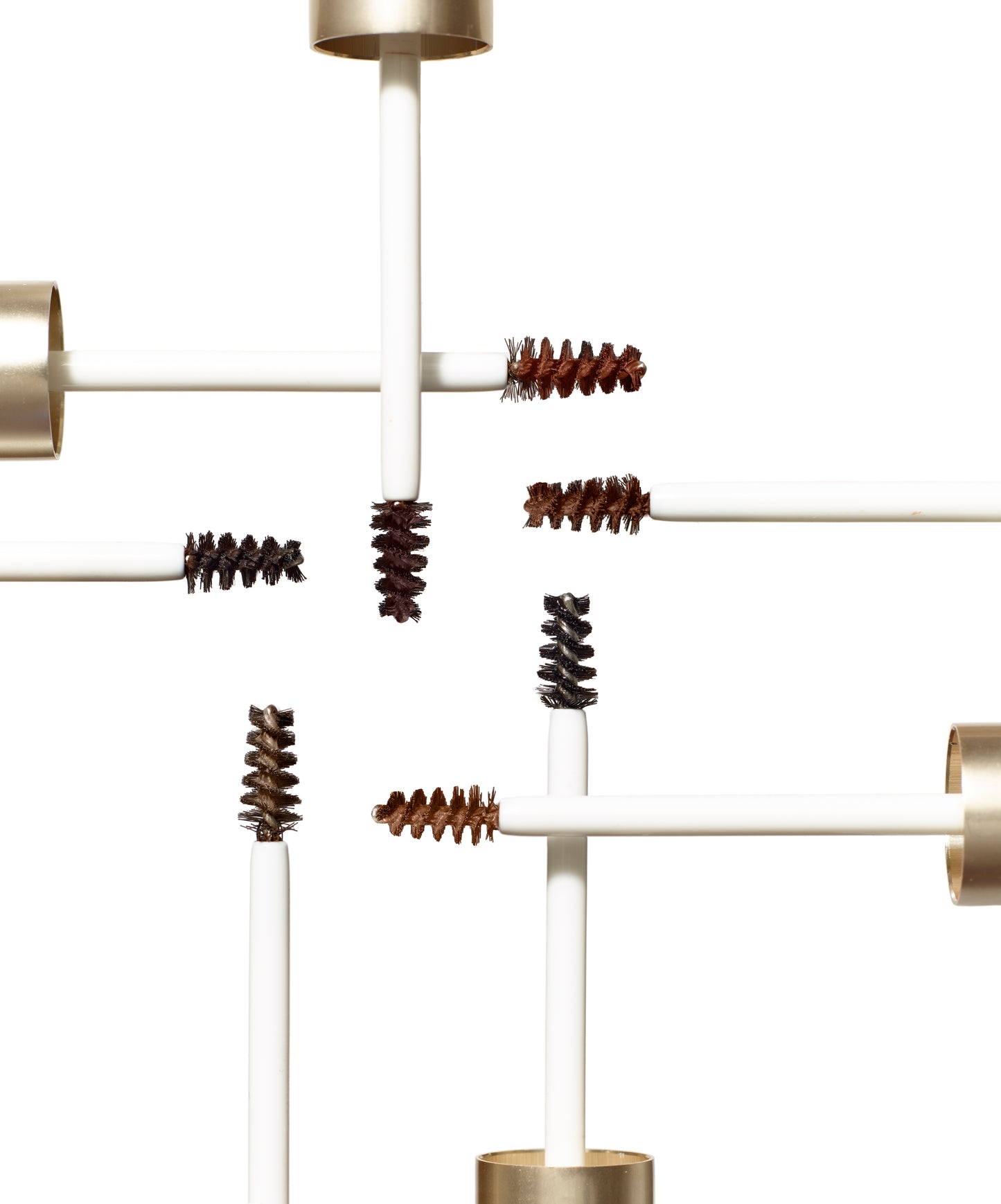PureBrow® Brow Gel wands display in varying tints on white, showcasing precise brushes for defining and setting brows with a natural, polished finish.