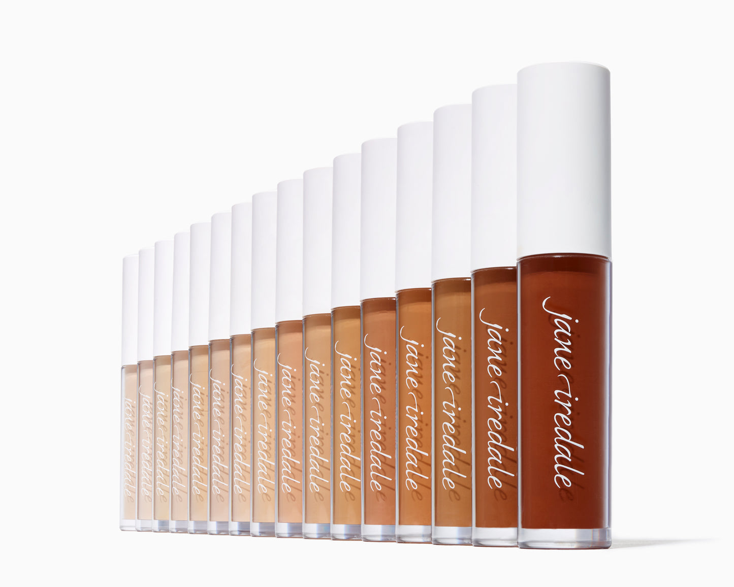 Jane Iredale PureMatch™ Liquid Concealer tubes, arranged light to dark, showcasing diverse shades for seamless, natural coverage with a doe-foot applicator for precise application.