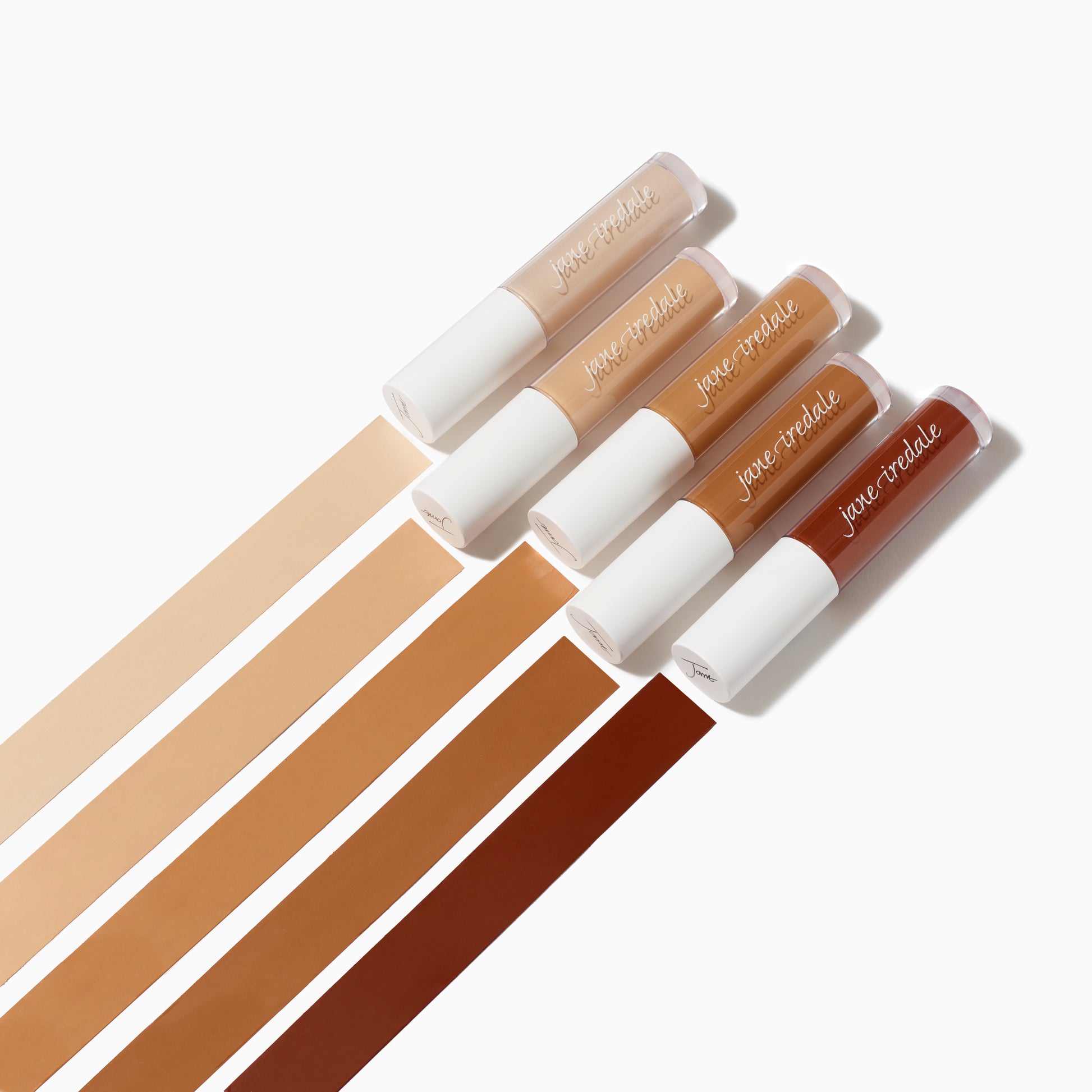 PureMatch™ Liquid Concealer tubes displayed with matching swatches, showcasing diverse shades for seamless, buildable coverage and a natural finish.