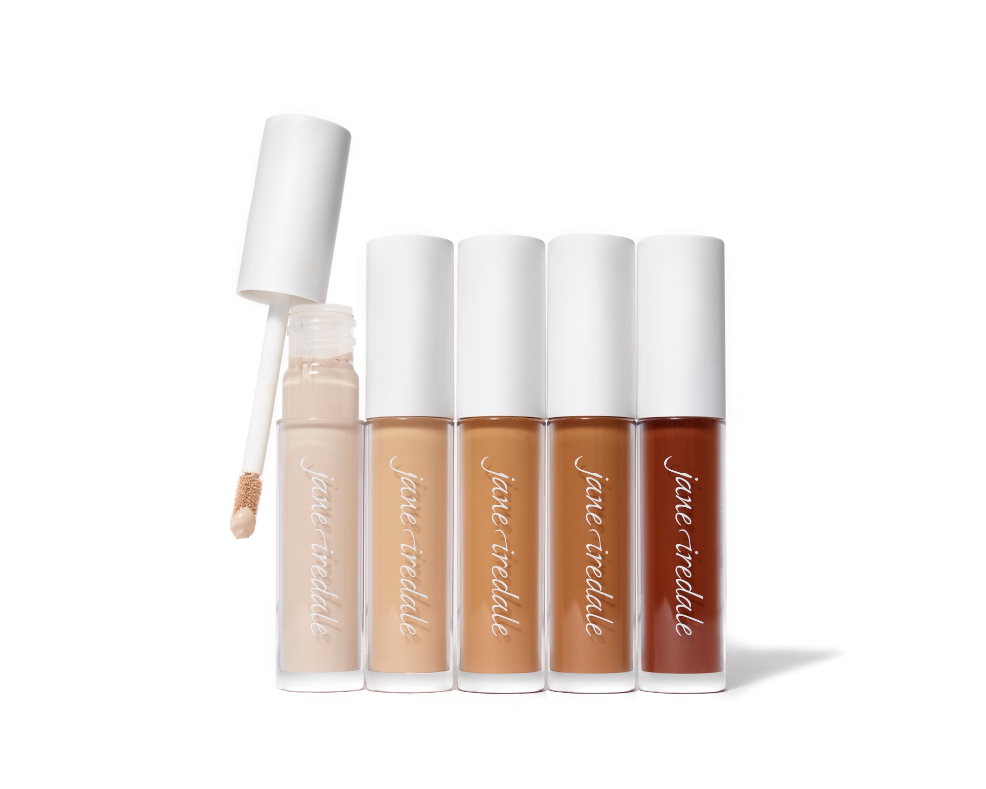 PureMatch™ Liquid Concealer tubes by Jane Iredale, arranged by shade. One tube is open, showing a doe-foot applicator for precise application.