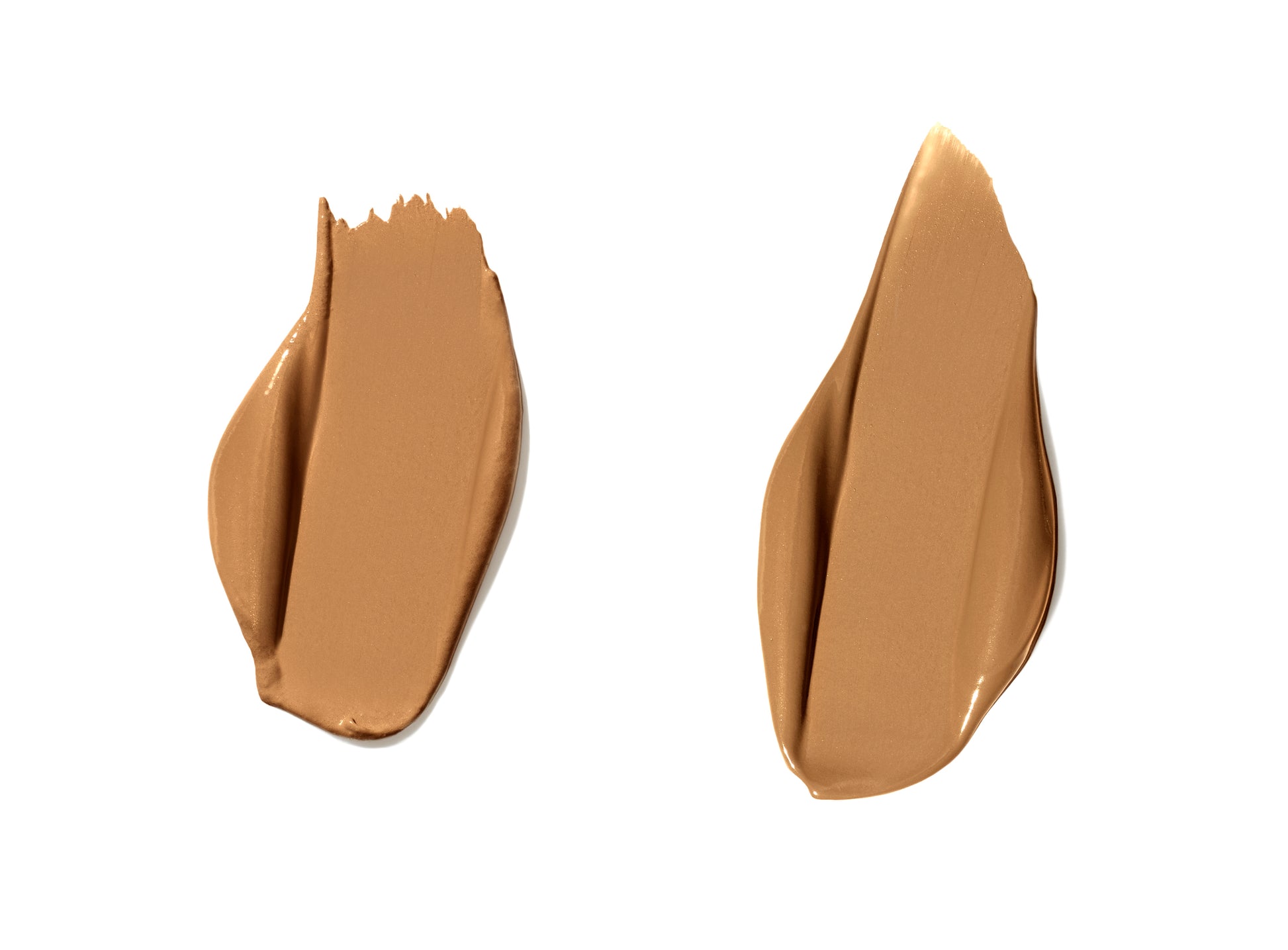 Two swatches of PureMatch™ Liquid Concealer smeared on white background, illustrating its creamy texture and seamless blend for natural, buildable coverage.