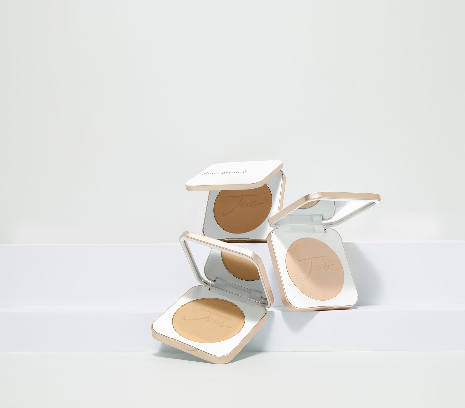 PurePressed® Base Mineral Foundation SPF 20/15 Refill in white compact cases, showcasing beige pressed powder for natural, luminous skin with built-in SPF protection.