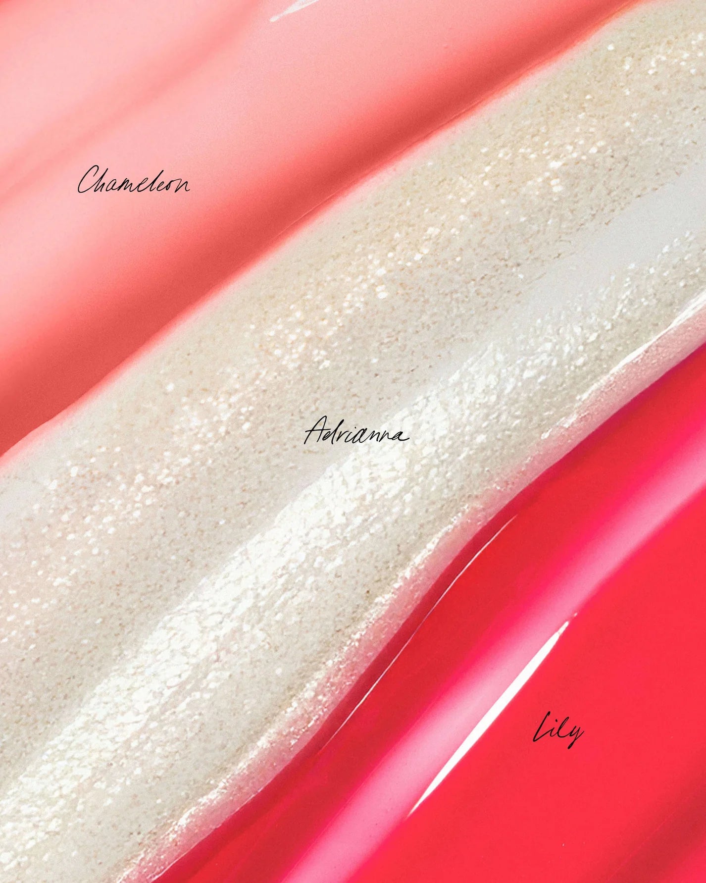 Mini Lip Oil Trio close-up: three glossy swatches—peachy-coral, ice-white, and pink/red—showcasing nourishing, high-shine lip oils from Beauty Shop Bellaire.