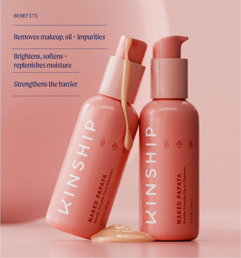 Two coral-pink SKINSHIP Naked Papaya Gentle Enzyme Milky Cleanser bottles, one tilted with gel spilling, showcasing makeup removal and skin hydration benefits.