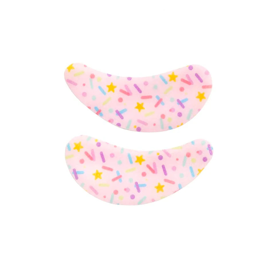 Eye Want Cake Smoothing & Hydrating Eye Patches feature pastel pink sprinkles design, offering a hydrating, soothing under-eye treatment with a sweet, frosting-inspired scent.