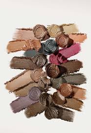 ReDimension Hydra Eyes Quartet featuring cream-to-powder swatches in neutral tones, artfully arranged on a white background, showcasing versatile eye makeup options.