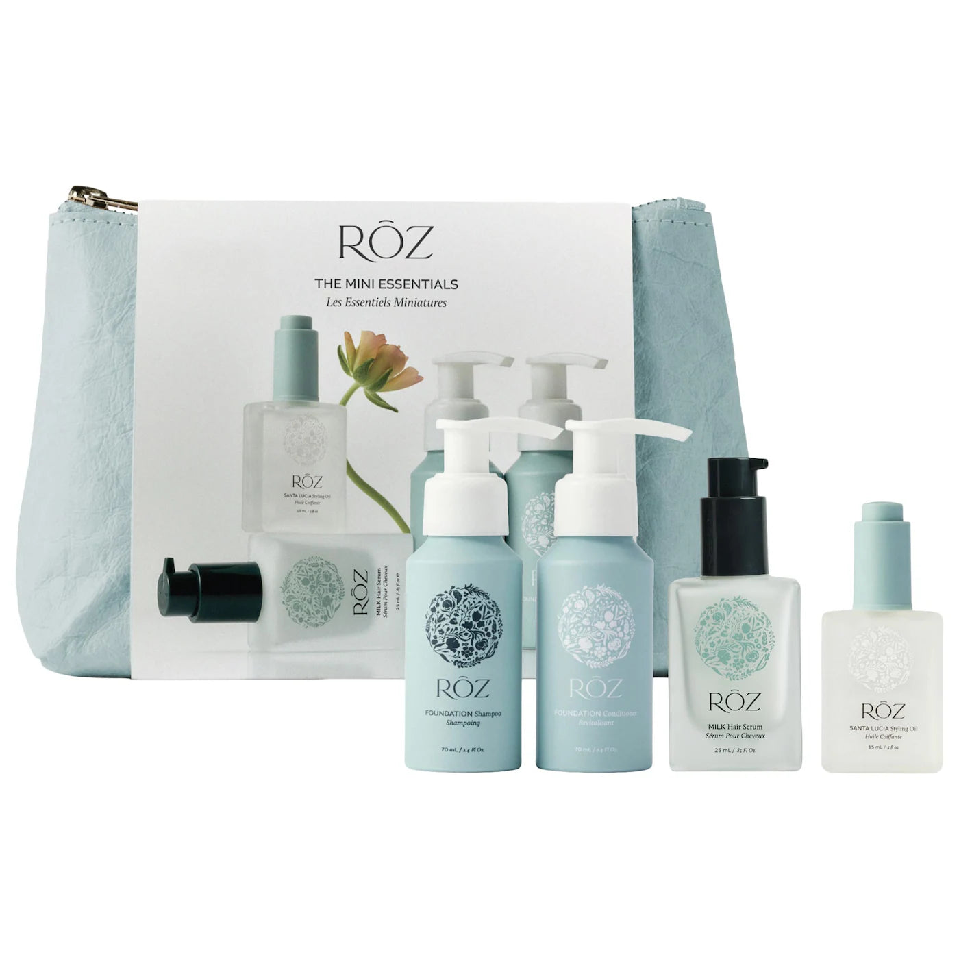 RÖZ “Mini Essentials” travel kit with four small pump-top bottles and a drop-top bottle, all neatly arranged in front of a pale-blue zippered pouch.